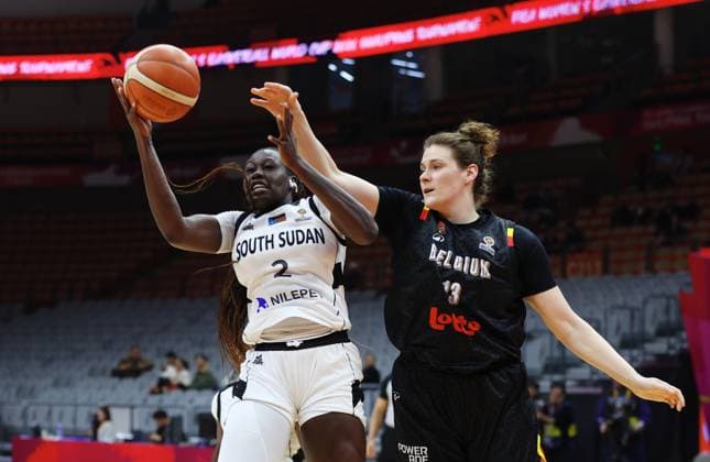 South Sudan s Adut Bulgak and Belgium s Kyara Linskens fight for the ball during a basket game between Belgium s national team, Nationalteam Belgian Cats and South Sudan, in Wuhan, China, on Sunday 15 March 2026, the fourth game (out of 5) of the qualifications phase for the World Cup Basket tournament. NIKOLAxKRSTIC  x167535726x