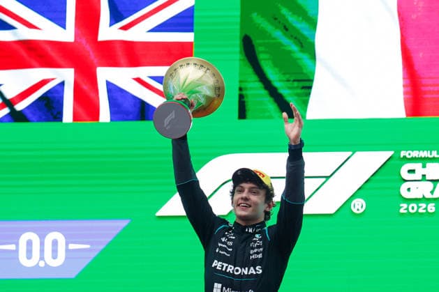 CHINA-MOTORSPORTS F1-SHANGHAI Mercedes™ Kimi Antonelli holding up his trophy on the podium after coming in top 3 at Shanghai International Circuit at the F1 Chinese Grand Prix, Shanghai, China, March 15, 2026. NEXPHER Peter Li SHANGHAI