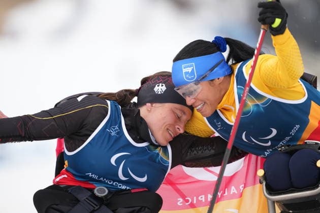 (260315) -- TESERO, March 15, 2026 -- Anja Wicker (L) of Germany hugs with Aline dos Santos Rocha of Brazil after the para cross-country skiing women s 20km interval start sitting at the Milan-Cortina 2026 Paralympic Winter games, Winterspiele,Spiele, Summer games in Tesero, Italy, March 15, 2026. ) (SP)ITALY-TESERO-PARALYMPIC WINTER GAMES-PARA CROSS-COUNTRY SKIING-WOMEN S 20KM INTERVAL START SITTING HouxZhaokang 