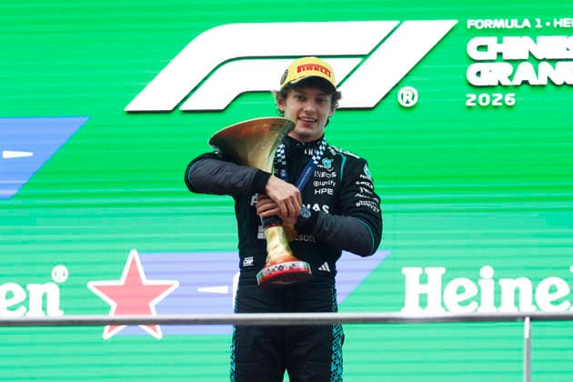 CHINA-MOTORSPORTS F1-SHANGHAI Mercedes™ Kimi Antonelli holding up his trophy on stage after winning at Shanghai International Circuit at the F1 Chinese Grand Prix, Shanghai, China, March 15, 2026. NEXPHER Peter Li SHANGHAI