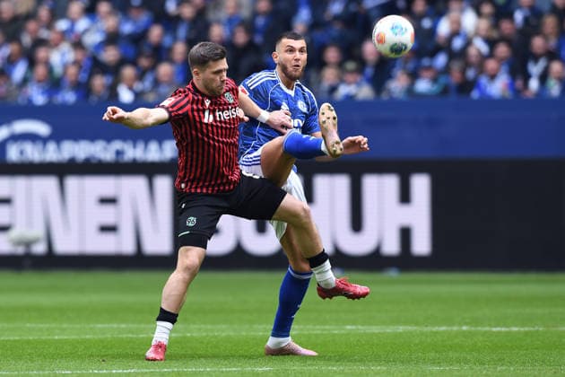 Soccer 2 Bundesliga 26 Matchday FC Schalke 04 Hannover 96 on 15 03 2026 at the Veltins Arena in Gelsenkirchen Benjamin Källman Hannover , front Hasan Kurucay Schalke , back DFL regulations prohibit any use of photographs as image sequences and or quasi video xRx