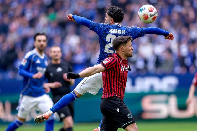 15 03 2026, Football, FC Schalke 04 Hannover 96, Matchday 26, 2 Fußball Bundesliga, Veltins Arena Gelsenkirchen, Saison 2025 2026 Soufiane El Faouzi Schalke04 23 in duel against Maik Nawrocki Hannover96 06 DFB regulations prohibit any use of photographs as image sequences and or quasi video Nordrhein Westfalen Germany