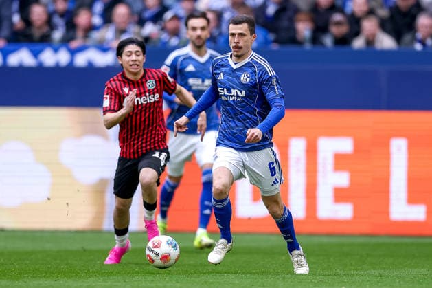 15 03 2026, Football, FC Schalke 04 Hannover 96, Matchday 26, 2 Fußball Bundesliga, Veltins Arena Gelsenkirchen, Saison 2025 2026 Ron Schallenberg Schalke04 06 in duel against Daisuke Yokota Hannover96 18 DFB regulations prohibit any use of photographs as image sequences and or quasi video Nordrhein Westfalen Germany