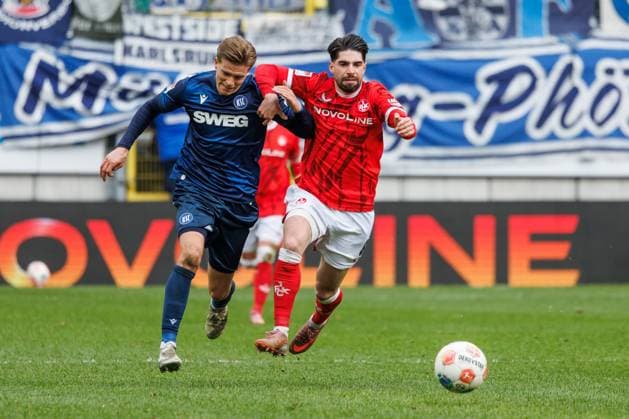 Dzenis Burnic Karlsruher SC in duel with Semi Sahin 1 FC Kaiserslautern , 1 FC Kaiserslautern vs Karlsruher SC, Soccer, 2 Bundesliga, Matchday 26, Season 2025 2026, 15 03 2026 1 FC Kaiserslautern vs Karlsruher SC, Soccer, 2 Bundesliga, Matchday 26, Season 2025 2026, 15 03 2026 Copyright: xEibner-Pressefoto AlexanderxNeisx EP_ANS