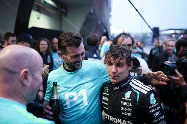 March 15, 2026, Shanghai, Shanghai, China: Mercedes-AMG Petronas Formula One Team driver ANDREA KIMI ANTONELLI is embraced by team staff after the champagne celebration following his victory at the Formula One Chinese Grand Prix at Shanghai International Circuit. Shanghai China - ZUMAh201 20260315_zsp_h201_050 Copyright: xYichinxHoux