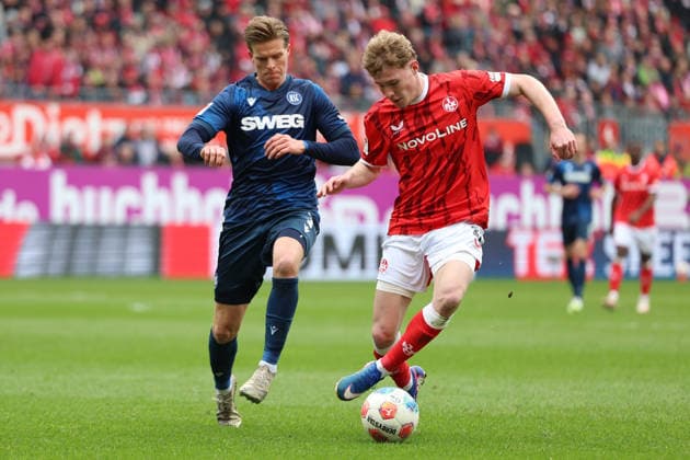 15 03 2026, xrekx, Fußball 2 Bundesliga, 1 FC Kaiserslautern Karlsruher SC v l Dzenis Burnic Karlsruher SC Mika Haas 1 FC Kaiserslautern Zweikampf, Aktion, action, battle for the ball DFL DFB REGULATIONS PROHIBIT ANY USE OF PHOTOGRAPHS as IMAGE SEQUENCES and or QUASI VIDEO Kaiserslautern