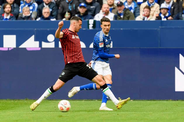 Bastian Allgeier Hannover 96 and Dejan Ljubicic FC Schalke battle for the ball during the 2 Bundesliga match between FC Schalke 04 and Hannover 96, Veltins Arena on March 15, 2026 in Gelsenkirchen, Germany, Germany Photo by Max Maiwald DeFodi Images Bastian Allgeier Hannover 96 and Dejan Ljubicic FC Schalke battle for the ball during the 2 Bundesliga match between FC Schalke 04 and Hannover 96 at Veltins Arena on March 15, 2026 in Gelsenkirchen, Germany Photo by Max Maiwald DeFodi Images Photo by Max Maiwald DeFodi Images