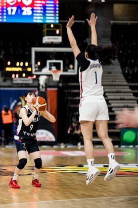 LYON-VILLEURBANNE, FRANCE - MARCH 15: Yeeun Heo (Republic of Korea, 2) shoots a three pointer over Sumayah Sugapong (Philippines, 1) during the FIBA Women™s World Cup Qualifying Tournament match between Philippines (PHI) vs. Republic of Korea (KOR) at Astroballe on matchday 4 of the FIBA Women™s World Cup Qualifying Tournament on March 15, 2026 in Lyon-Villeurbanne, France. France Copyright: xSteffiexWunderlx