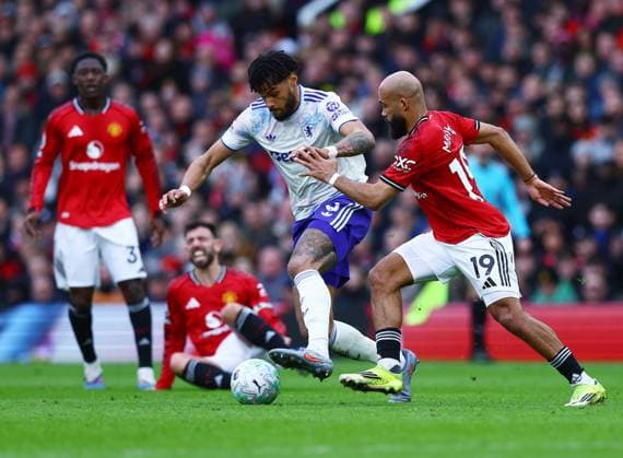 Tyrone Mings of Aston Villa and Bryan Mbeumo of Manchester United, ManU Manchester United v Aston Villa, Premier League, Football, Old Trafford, Manchester, UK - 15 Mar 2026Manchester Old Trafford United Kingdom EDITORIAL USE ONLY No use with unauthorised audio, video, data, fixture lists, club league logos or live services. Online in-match use limited to 120 images, no video emulation. No use in betting, games or single club league player publications. Copyright: xMattxWest Shutterstockx 16757312t