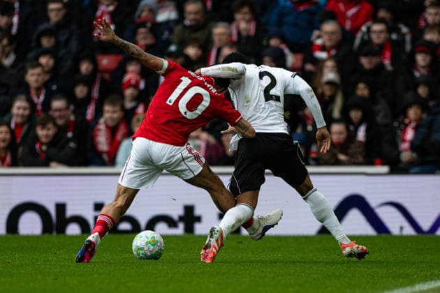 15th March 2026; The City Ground, Nottingham, England; Premier League Football, Nottingham Forest versus Fulham; Kenny Tete of Fulham FC holds Morgan Gibbs-White of Nottingham Forest around the neck  GodfreyxPitt Content restricted for UK based newspaper
