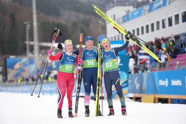(260315) -- TESERO, March 15, 2026 -- Gold medalist Sydney Peterson (C) of the United States, silver medalist Vilde Nilsen (L) of Norway, bronze medalist Oleksandra Kononova of Ukraine pose after the para cross-country skiing women s 20km interval start free standing at the Milan-Cortina 2026 Paralympic Winter games, Winterspiele,Spiele, Summer games in Tesero, Italy, March 15, 2026. Lian Zhen) (SP)ITALY-TESERO-PARALYMPIC WINTER GAMES-PARA CROSS-COUNTRY SKIING-WOMEN S 20KM INTERVAL START FREE STANDING HouxZhaokang 