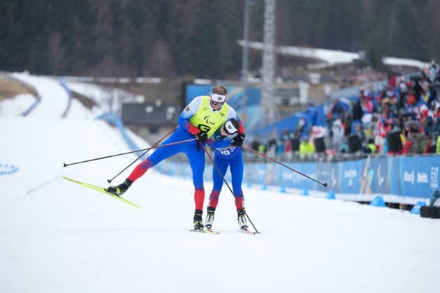 (260315) -- TESERO, March 15, 2026 -- Anastasiia Bagiian (R) and her guide Sergei Siniakin of Russia celebrate after the para cross-country skiing women s 20km interval start free vision impaired at the Milan-Cortina 2026 Paralympic Winter games, Winterspiele,Spiele, Summer games in Tesero, Italy, March 15, 2026. ) (SP)ITALY-TESERO-PARALYMPIC WINTER GAMES-PARA CROSS-COUNTRY SKIING-WOMEN S 20KM INTERVAL START FREE VISION IMPAIRED HouxZhaokang 