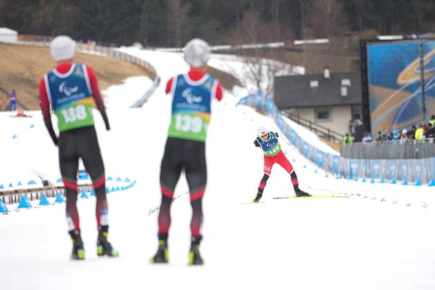 (260315) -- TESERO, March 15, 2026 -- Wang Chenyang (R) of China competes during the para cross-country skiing men s 20km interval start free standing at the Milan-Cortina 2026 Paralympic Winter games, Winterspiele,Spiele, Summer games in Tesero, Italy, March 15, 2026. ) (SP)ITALY-TESERO-PARALYMPIC WINTER GAMES-PARA CROSS-COUNTRY SKIING-MEN S 20KM INTERVAL START FREE STANDING HouxZhaokang 