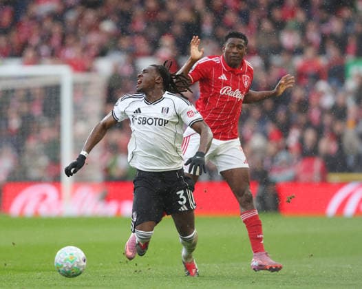 Nottingham, England, 15th March 2026. Calvin Bassey of Fulham and Taiwo Awoniyi of Nottingham Forest during the Nottingham Forest vs Fulham Premier League match at the City Ground, Nottingham. Picture credit should read: Gareth Evans Sportimage EDITORIAL USE ONLY. No use with unauthorised audio, video, data, fixture lists, club league logos or live services. Online in-match use limited to 120 images, no video emulation. No use in betting, games or single club league player publications. SPI_025_GE_NFFC_vs_FFC SPI-4604-0025