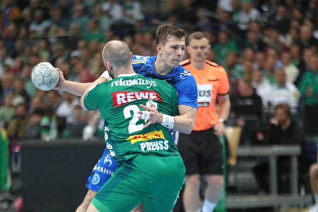 Handball DAIKIN HBL, SC DHfK Leipzig TVB Stuttgart 15 03 2026 Marco Mengon 30, TVB Stuttgart sticks to Moritz Preuss 24, SC DHfK Leipzig Handball, DAIKIN HBL, 1 Bundesliga, Season 2025 2026, 25 Matchday SC DHfK Leipzig vs TVB Stuttgart on 15 03 2026 at Quarterback Immobilien Arena Leipzig Copyright: xBEAUTIFULxSPORTS JanxKaeferx