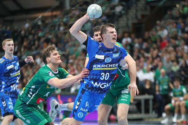 Handball DAIKIN HBL, SC DHfK Leipzig TVB Stuttgart 15 03 2026 Marco Mengon 30, TVB Stuttgart cannot be held by Blaer Hinriksson 44, SC DHfK Leipzig Handball, DAIKIN HBL, 1 Bundesliga, Season 2025 2026, 25 Matchday SC DHfK Leipzig vs TVB Stuttgart on 15 03 2026 at Quarterback Immobilien Arena Leipzig Copyright: xBEAUTIFULxSPORTS JanxKaeferx