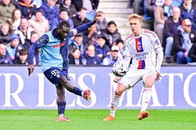 FOOTBALL : Le Havre vs Lyon - Ligue 1 - 15 03 2026 Arouna Sangante of Le Havre and Adam Karabec of Lyon during the Ligue 1 match between Havre AC and Olympique Lyonnais at Stade Oceane on March 15, 2026 in Le Havre, France. ( Photo by Federico Pestellini PsnewZ ) - Le HavreFrance  Copyright: xFedericoxPestellinix