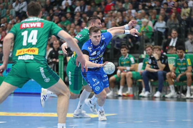 Handball DAIKIN HBL, SC DHfK Leipzig TVB Stuttgart 15 03 2026 Marco Mengon 30, TVB Stuttgart prevails against Luka Rogan 33, SC DHfK Leipzig Handball, DAIKIN HBL, 1 Bundesliga, Season 2025 2026, 25 Matchday SC DHfK Leipzig vs TVB Stuttgart on 15 03 2026 at Quarterback Immobilien Arena Leipzig Copyright: xBEAUTIFULxSPORTS JanxKaeferx
