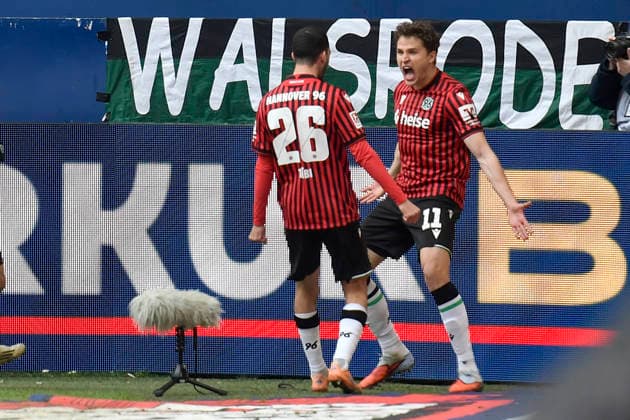 Benedikt Pichler Hannover 11 celebrates after scoring 2 2 with Waniss Taibi Hannover 26 15 03 2026 ¢ Football ¢ FC Schalke 04 vs Hannover 96, Veltins Arena, Gelsenkirchen, DFB DFL REGULATIONS PROHIBIT ANY USE OF PHOTOGRAPHS AS IMAGE SEQUENCES AND OR QUASI VIDEO Copyright: xpepphotox xSaschaxWeizx pep00321, pep_20260315_hm_311970