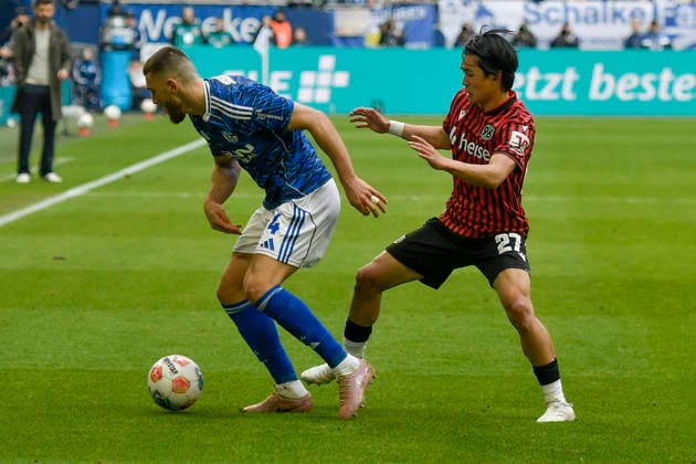 v li in duel Hasan Kurucay Schalke 4 Hayate Matsuda Hannover 27 15 03 2026 ¢ Football ¢ FC Schalke 04 vs Hannover 96, Veltins Arena, Gelsenkirchen, DFB DFL REGULATIONS PROHIBIT ANY USE OF PHOTOGRAPHS AS IMAGE SEQUENCES AND OR QUASI VIDEO Copyright: xpepphotox xSaschaxWeizx pep00321, pep_20260315_hm_311880