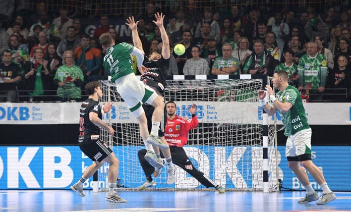 Lasse Andersson scores a goal against goalkeeper Khalifa Ghedbane duel Match scene Action Sport Handball HBL Bundesliga Men 25 Matchday Season 2025 2026 15 03 2026 Füchse Berlin vs HC Erlangen HCE