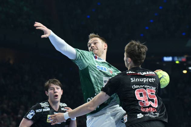 15 03 2026, xlakx, Handball Daikin HBL, Fuechse Berlin HC Erlangen f l Mathias Gidsel Fuechse Berlin , Tim Goemmel HC Erlangen goes for a jump shot Berlin Daniel Lakomski