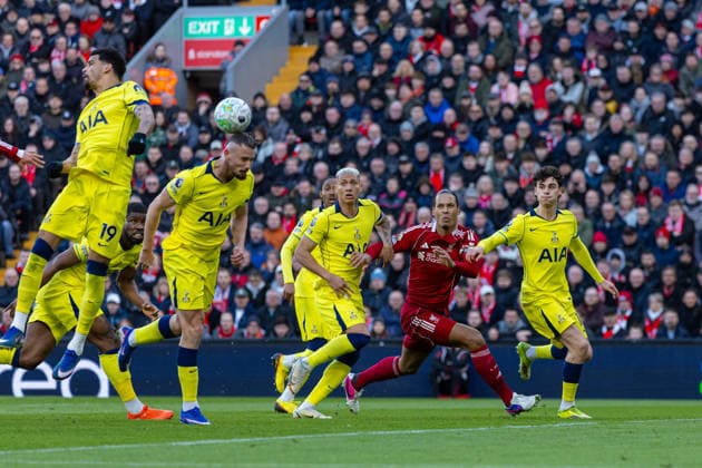 Football - FA Premier League - Liverpool FC v Tottenham Hotspur FC LIVERPOOL, ENGLAND - Sunday, March 15, 2026: Tottenham Hotspur s Radu DrÄƒguÈ™in heads the ball away as Liverpool s captain Virgil van Dijk is waiting for the ball during the FA Premier League match between Liverpool FC and Tottenham Hotspur FC at Anfield. (Photo by David Rawcliffe Propaganda) LIVERPOOL Anfield MERSEYSIDE ENGLAND  Copyright: xDavidxRawcliffex P2026-03-15-Liverpool_Tottenham-57