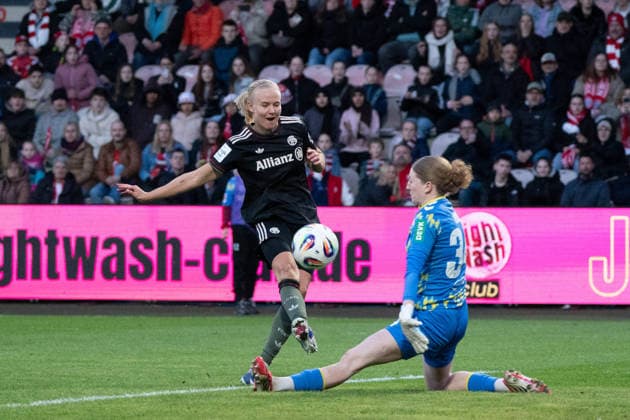 COLOGNE, GERMANY - MARCH 15: Pernille Harder (21 FC Bayern München) and Goalkeeper Irina Fuchs (34 1. FC Köln) during the Google Pixel Frauen-Bundesliga between 1. FC Köln and FC Bayern München at Stadion an der Hafenstraße on March 15, 2026 in Cologne, Germany. ?Photo by Qianru Zhang Press Photo) Copyright: xQianruxZhang SPPx Sportspressphoto_SPR110728