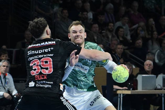 15 03 2026, xlakx, Handball Daikin HBL, Fuechse Berlin HC Erlangen v l Tobias Buck HC Erlangen , Mathias Gidsel Fuechse Berlin duel, duel, fight, tackle Berlin Daniel Lakomski