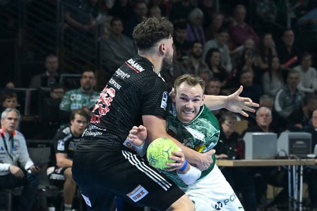 15 03 2026, xlakx, Handball Daikin HBL, Fuechse Berlin HC Erlangen v l Tobias Buck HC Erlangen , Mathias Gidsel Fuechse Berlin duel, duel, fight, tackle Berlin Daniel Lakomski