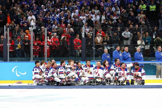 March 15, 2026, Milan, Lombardy, Italy: TEAM USA PLAYERS of whom final mvp JACK WALLACE, superstar DECLAN FARMER and captain JOSH PAULS with their teammates and headcoach DAVID HOFF pose with their gold medals after the Final game between Team United States (USA) and Team Canada (CAN) at the Milano Cortina 2026 Paralympic Winter games, Winterspiele,Spiele, Summer games USA defeated Canada 6:2 and won the Gold. Milan Italy - ZUMAc179 20260315_oly_c179_040 Copyright: xMickaelxChavetx