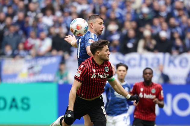 Gelsenkirchen, Germany, 15 03 26, Edin Dzeko FC Schalke 04 and Enzo Leopold Hannover 96 in a duel during the Bundesliga 2 match between FC Schalke 04 Hannover 96 at the Veltins Arena in Gelsenkirchen Photo by Joachim Bywaletz DFB DFL REGULATIONS PROHIBIT ANY USE OF PHOTOGRAPHS AS IMAGE SEQUENCES AND OR QUASI VIDEO Copyright: JoachimxBywaletz xJB-Sportfoto
