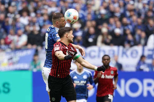 Gelsenkirchen, Germany, 15 03 26, Edin Dzeko FC Schalke 04 and Enzo Leopold Hannover 96 in a duel during the 2 Bundesliga match between FC Schalke 04 Hannover 96 at the Veltins Arena in Gelsenkirchen Photo by Joachim Bywaletz DFB DFL REGULATIONS PROHIBIT ANY USE OF PHOTOGRAPHS AS IMAGE SEQUENCES AND OR QUASI VIDEO Copyright: JoachimxBywaletz xJB-Sportfoto