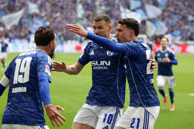 Gelsenkirchen, Germany, 15 03 26, center Edin Dzeko FC Schalke 04 cheers after his goal for 1 0 with left Kenan Karaman FC Schalke 04 and right Dejan Ljubicic FC Schalke 04 during the Bundesliga 2 match between FC Schalke 04 Hannover 96 at the Veltins Arena in Gelsenkirchen Photo by Joachim Bywaletz DFB DFL REGULATIONS PROHIBIT ANY USE OF PHOTOGRAPHS AS IMAGE SEQUENCES AND OR QUASI VIDEO Copyright: JoachimxBywaletz xJB-Sportfoto