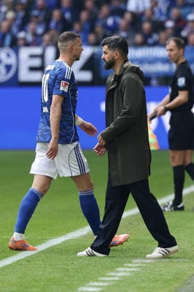 Gelsenkirchen, Germany, 15 03 26, Edin Dzeko FC Schalke 04 walks past Miron Muslic head coach FC Schalke 04 after receiving a red card during the Bundesliga 2 match between FC Schalke 04 Hannover 96 at the Veltins Arena in Gelsenkirchen Photo by Joachim Bywaletz DFB DFL REGULATIONS PROHIBIT ANY USE OF PHOTOGRAPHS AS IMAGE SEQUENCES AND OR QUASI VIDEO Copyright: JoachimxBywaletz xJB-Sportfoto