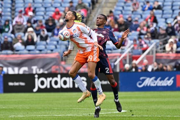 March 15, 2026; Foxborough, Massachusetts; FC Cincinnati forward Ayoub Jabbari (99) controls the ball against New England Revolution defender Mamadou Fofana (2) during the first half at Gillette Stadium. CSM Foxborough USA - ZUMAc04_ 20260315_faf_c04_010 Copyright: xEricxCanhax