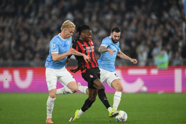 15th March 2026, Stadio Olimpico, Rome, Italy; Italian Serie A Football; Lazio versus AC Milan; Rafael Leao of AC Milan under pressure from Oliver Provstgaard of SS Lazio  AllShotLive Content restricted for UK based newspaper