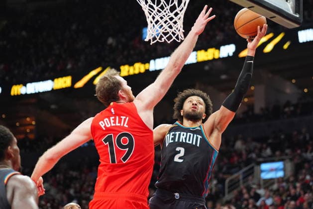 March 15, 2026, Toronto, On, Canada: Detroit Pistons guard Cade Cunningham (2) goes to the basket as Toronto Raptors center Jakob Poeltl (19) defends during second half NBA, Basketball Herren, USA basketball action in Toronto on Sunday, March 15, 2026. Canada News - March 15, 2026  - ZUMAc35_ 20260315_zaf_c35_126 Copyright: xFrankxGunnx