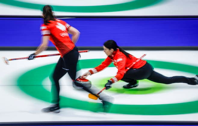 March 15, 2026, Calgary, Ab, CANADA: Team Canada skip Kerri Einarson, right, delivers a stone against China as second Shannon Birchard looks on at the World Women™s Curling Championship in Calgary, Sunday, March 15, 2026. Kerri Einarson, Shannon Birchard  - ZUMAc35_ 20260315_zaf_c35_184 Copyright: xJeffxMcintoshx