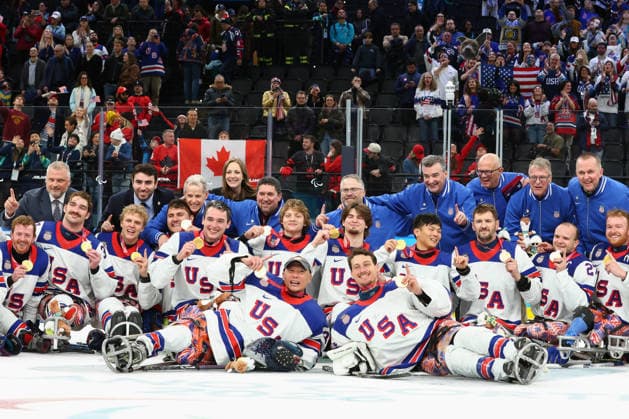 March 15, 2026, Milan, Lombardy, Italy: Team USA players of whom hat-trick goal scorer JACK WALLACE, tournament Mvp DECLAN FARMER, captain JOSH PAULS, goalie GRIFFIN LAMARRE and coach DAVID HOFF celebrate with their gold medals after the Final game between Team United States (USA) and Team Canada (CAN) at the Milano Cortina 2026 Paralympic Winter games, Winterspiele,Spiele, Summer games Team USA won 6:2 and their fifth consecutive Para Ice hockey, Eishockey Paralympics 2026: Milano Cortina: USA Make It Five-In-A-Row In Sled Hockey  - ZUMAc179 20260315_oly_c179_130 Copyright: xMickaelxChavetx
