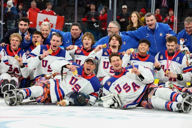 March 15, 2026, Milan, Lombardy, Italy: Team USA players of whom hat-trick goal scorer JACK WALLACE and goalie GRIFFIN LAMARRE celebrate with their gold medals after the Final game between Team United States (USA) and Team Canada (CAN) at the Milano Cortina 2026 Paralympic Winter games, Winterspiele,Spiele, Summer games Team USA won 6:2 and their fifth consecutive Para Ice hockey, Eishockey Paralympics 2026: Milano Cortina: USA Make It Five-In-A-Row In Sled Hockey  - ZUMAc179 20260315_oly_c179_135 Copyright: xMickaelxChavetx
