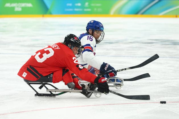 March 15, 2026, Milan, Lombardy, Italy: DECLAN FARMER 16 of USA and LIAM HICKEY of Canada contest the puck in the Final game between Team United States (USA) and Team Canada (CAN) at the Milano Cortina 2026 Paralympic Winter games, Winterspiele,Spiele, Summer games Team USA won 6:2 and their fifth consecutive Para Ice hockey, Eishockey Paralympics 2026: Milano Cortina: USA Make It Five-In-A-Row In Sled Hockey  - ZUMAc179 20260315_oly_c179_160 Copyright: xMickaelxChavetx