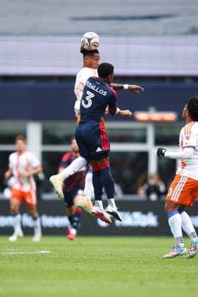March 15, 2026; Foxborough, Massachusetts, USA; FC Cincinnati forward Ayoub Jabbari (99) and New England Revolution defender Brayan Ceballos (3) jump for the header in a Major League Soccer game between the New England Revolution and FC Cincinnati at Gillette Stadium. (c) CSM - ZUMAc04_ 20260315_zma_c04_063 Copyright: xBurtxGranofskyx