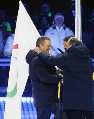 Milan Cortina Paralympics: Closing ceremony International Paralympic Committee President Andrew Parsons (L) hands the Paralympic flag to representatives of the French Alps, the next host region, during the closing ceremony of the Milan Cortina Paralympics at Cortina Curling Olympic Stadium on March 15, 2026, in Cortina d Ampezzo, Italy.  A14AA0005389321P