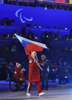 Milan Cortina Paralympics: Closing ceremony An athlete from Russia carries the Russian national flag during the closing ceremony of the Milan Cortina Paralympics at Cortina Curling Olympic Stadium on March 15, 2026, in Cortina d Ampezzo, Italy.  A14AA0005389426P