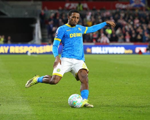 LONDON, ENGLAND - MARCH 16: Jackson Tchatchoua of Wolverhampton Wanderers crosses the ball during the Premier League match between Brentford and Wolverhampton Wanderers at Gtech Community Stadium on March 16, 2026 in London, England. Copyright: xJayxPatel SPPx Sportspressphoto_SPR112757