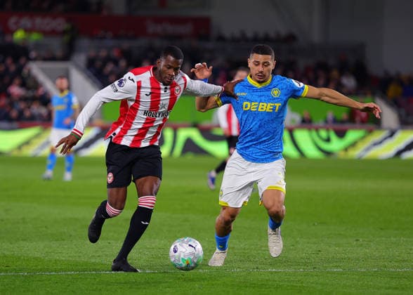 16th March 2026; Gtech Community Stadium, Brentford, London, England; Premier League Football, Brentford versus Wolverhampton Wanderers; Dango Ouattara of Brentford under pressure from Hugo Bueno of Wolverhampton Wanderers  JPxFletcher Content restricted for UK based newspaper