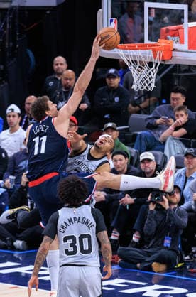 March 16, 2026, Inglewood, California, USA: Brook Lopez 11 of the Los Angeles Clippers hits the rim as he goes for a dunk during their 2026 NBA, Basketball Herren, USA regular season game against the San Antonio Spurs on Monday March 16, 2026 at Intuit Dome Arena in Inglewood, California. JAVIER ROJAS PI Inglewood USA - ZUMAp124 20260316_zaa_p124_017 Copyright: xJavierxRojasx