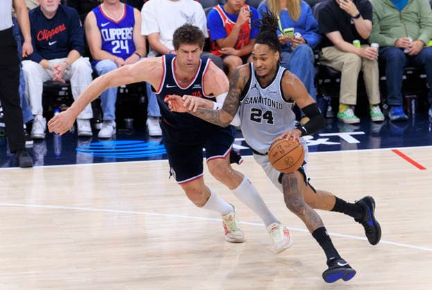 March 16, 2026, Inglewood, California, USA: Devin Vassell 24 of the San Antonio Spurs drives as Brook Lopez 11 of the Los Angeles Clippers defends during their regular season NBA, Basketball Herren, USA game on Monday March 16, 2026 at Intuit Dome in Inglewood, California. Clippers lose to Spurs, 119-115. ARIANA RUIZ PI Inglewood USA - ZUMAp124 20260316_zaa_p124_057 Copyright: xArianaxRuizx