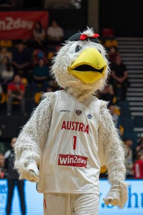 BASKETBALL - FIBA Quali, AUT vs SUI VIENNA,AUSTRIA,17.MAR.26 - BASKETBALL - FIBA Women s EURO Basket 2027, qualification, Austria vs Switzerland. Image shows mascot Airwin with a flag.  GEPAxpictures xGabrielxLopez